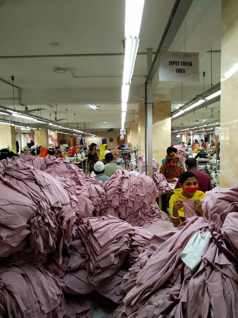 Stacked finished garments from bulk production